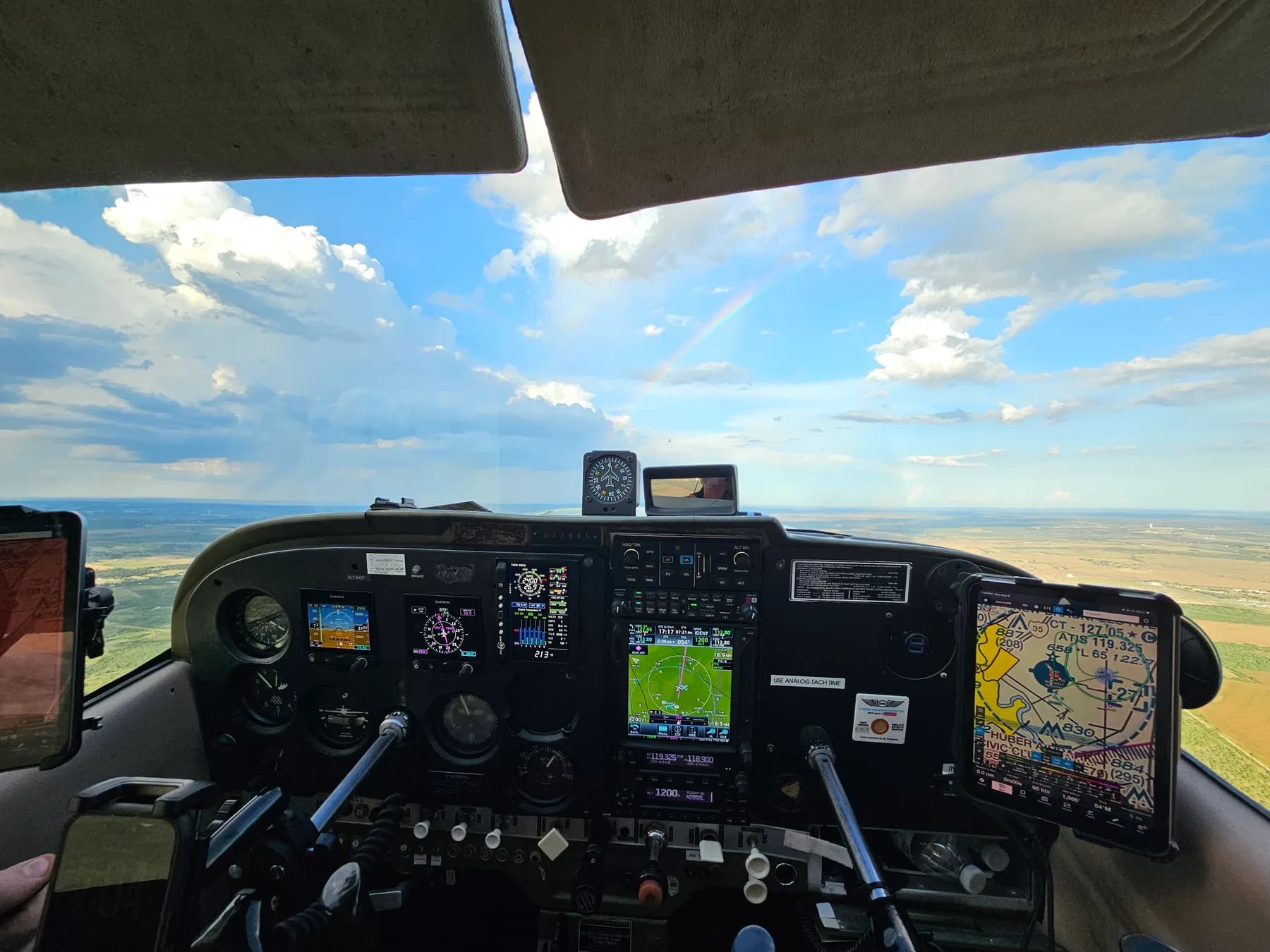 Cessna 172H instrument panel showing dual Garmin G5 displays, Garmin GTN-750, and Garmin GFC-500 autopilot in flight